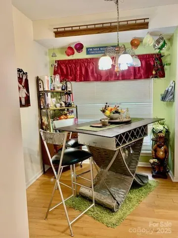 a view of a bedroom with furniture and windows
