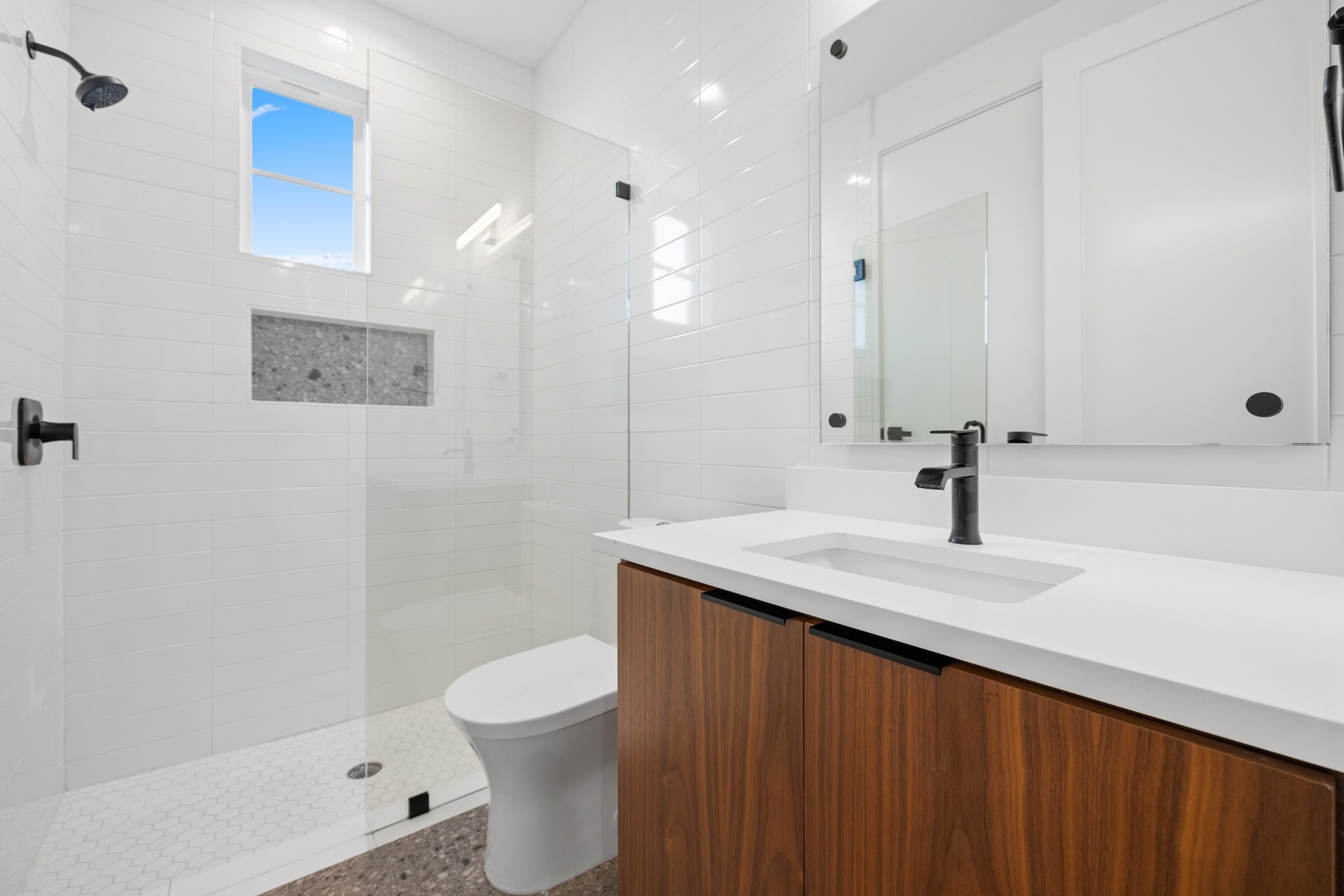 7706 Watson Street, Unit 2 Austin, TX 78757 - Photo 13 of 13 a bathroom with a sink a toilet and shower