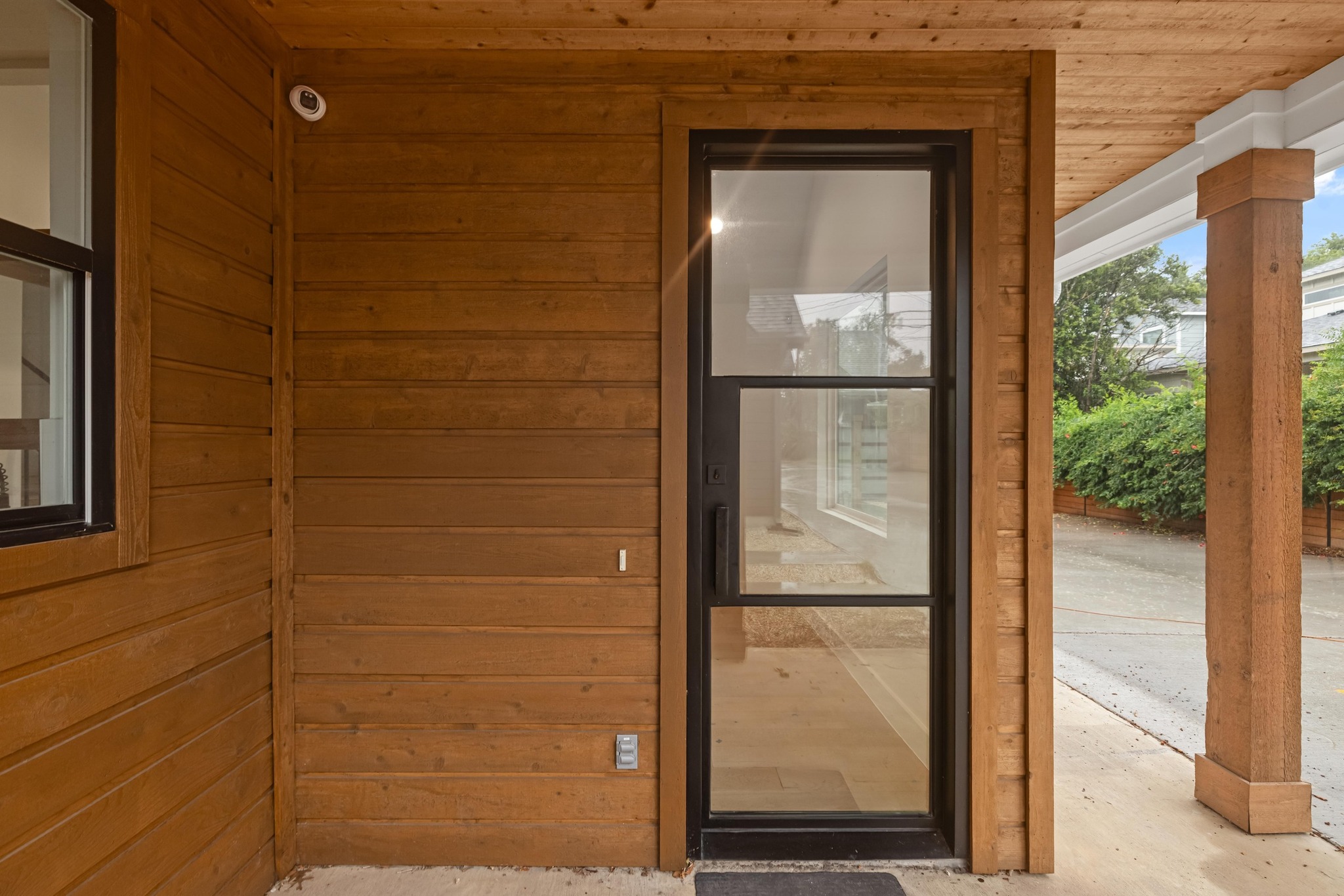 7706 Watson Street, Unit 2 Austin, TX 78757 - Photo 4 of 13 a glass door with a glass door