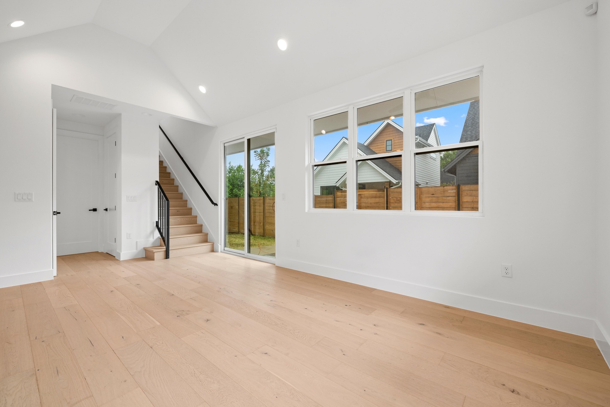 7706 Watson Street, Unit 2 Austin, TX 78757 - Photo 5 of 13 a view of an empty room with stairs