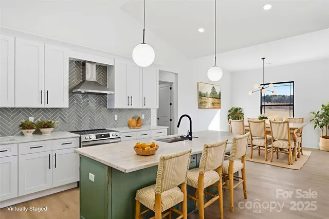 a kitchen with a sink stove and cabinets