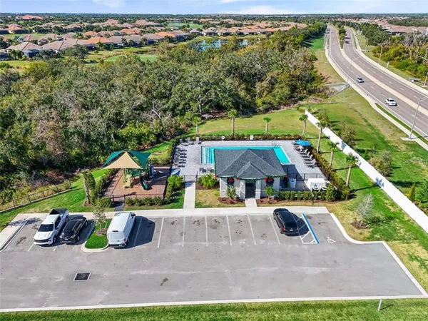 an aerial view of a house with garden space and street view