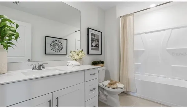 a bathroom with a toilet a sink and a bathtub