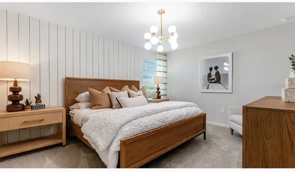 a bedroom with bed and window