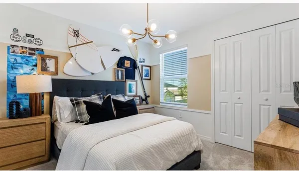 a bedroom with bed and window