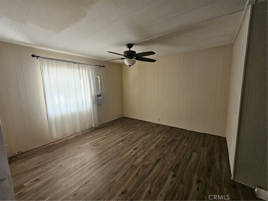 999 South Santa Fe Avenue, Unit 86 San Jacinto, CA 92583 - Photo 16 of 23 wooden floor in an empty room with a window