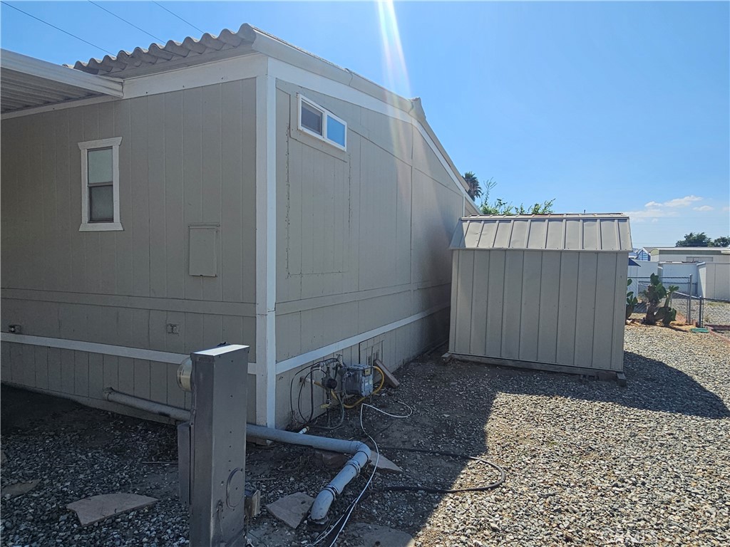 999 South Santa Fe Avenue, Unit 86 San Jacinto, CA 92583 - Photo 5 of 23 a view of a balcony with wooden floor and fence