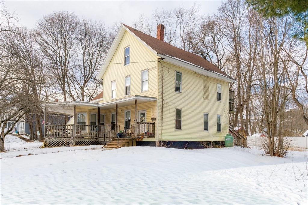 116 Maple Street Winchendon, MA 01475 - Photo 2 of 8 a view of a house with snow on the road