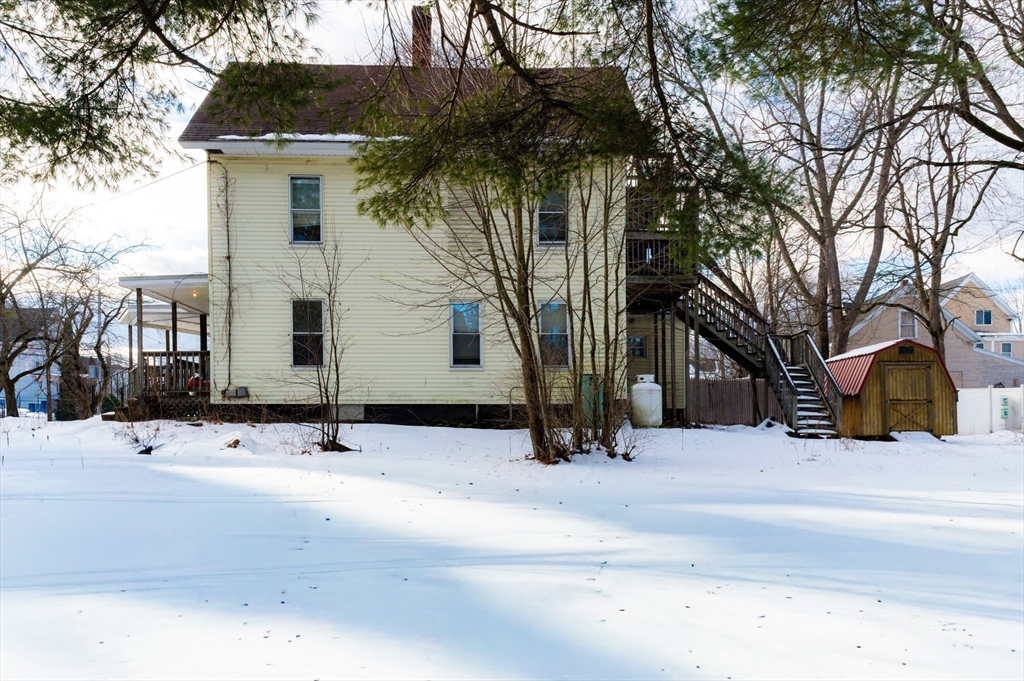 116 Maple Street Winchendon, MA 01475 - Photo 4 of 8 a view of a house with a snow in the yard