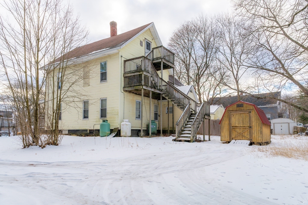 116 Maple Street Winchendon, MA 01475 - Photo 6 of 8 a view of a house with a snow in front of it