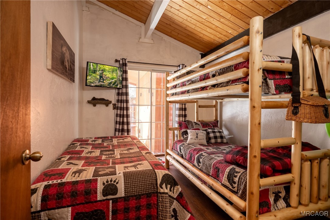 742 Cedar Lane Sugarloaf, CA 92386 - Photo 11 of 22 a bed room with a bed and a chair