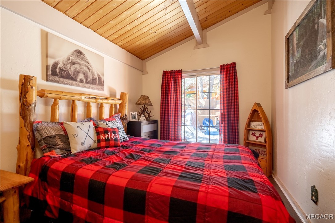 742 Cedar Lane Sugarloaf, CA 92386 - Photo 15 of 22 a bedroom with a bed and a painting on the wall