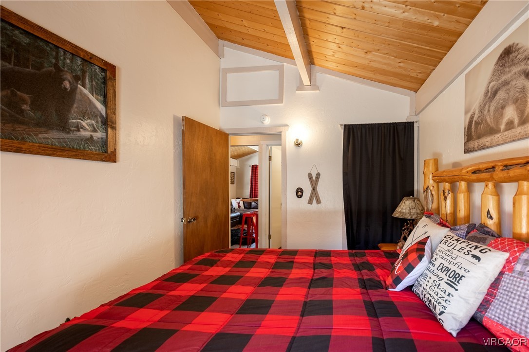 742 Cedar Lane Sugarloaf, CA 92386 - Photo 17 of 22 a bedroom with a bed and a painting on the wall