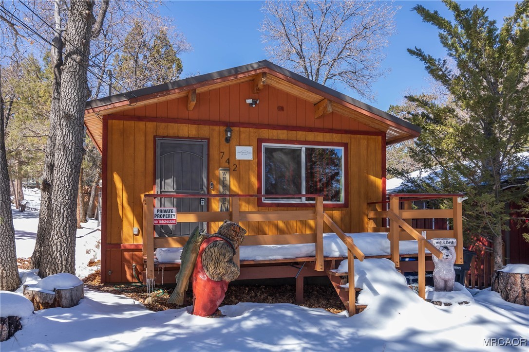 742 Cedar Lane Sugarloaf, CA 92386 - Photo 22 of 22 a view of a house with a yard and wooden fence