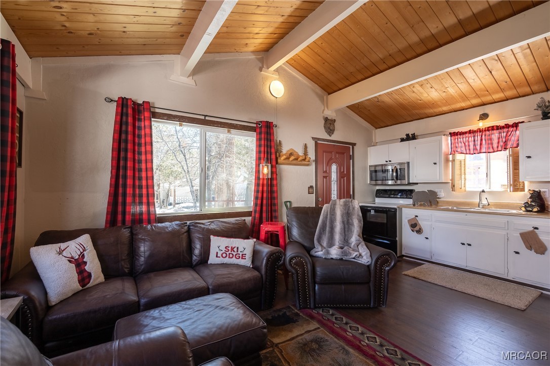 742 Cedar Lane Sugarloaf, CA 92386 - Photo 6 of 22 a living room with furniture kitchen view and a large window