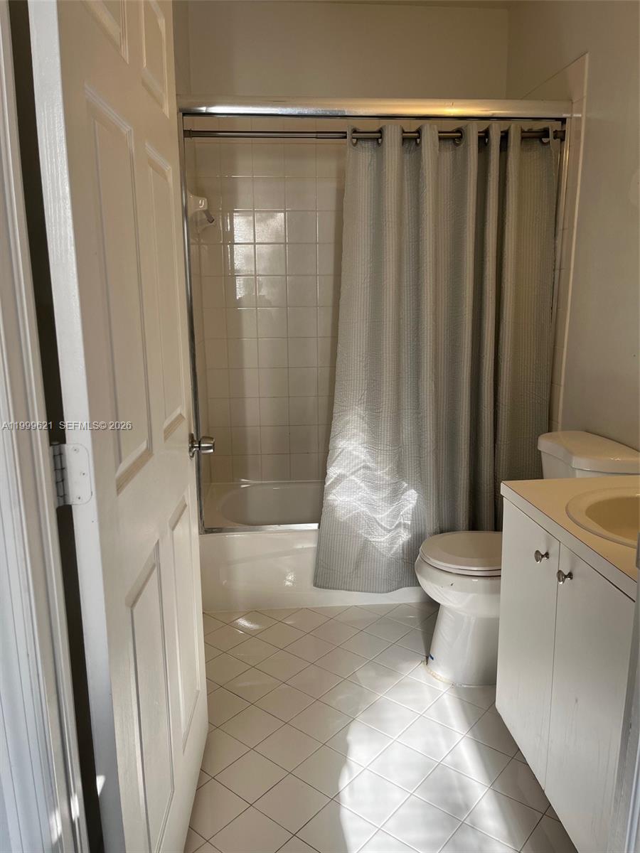 1650 Northeast 33rd Road, Unit 10610 Homestead, FL 33033 - Photo 12 of 22 a bathroom with a toilet and a shower
