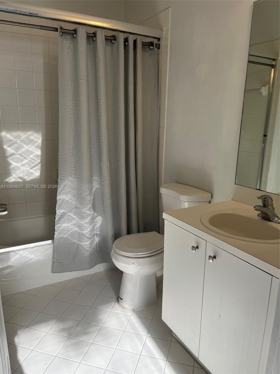 1650 Northeast 33rd Road, Unit 10610 Homestead, FL 33033 - Photo 13 of 22 a bathroom with a sink toilet and shower