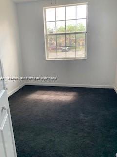 1650 Northeast 33rd Road, Unit 10610 Homestead, FL 33033 - Photo 16 of 22 an empty room with a window