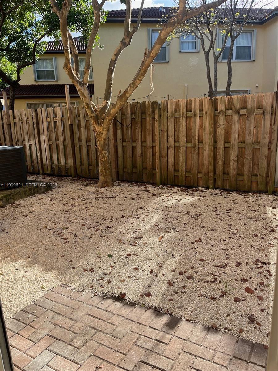 1650 Northeast 33rd Road, Unit 10610 Homestead, FL 33033 - Photo 18 of 22 a view of wooden fence