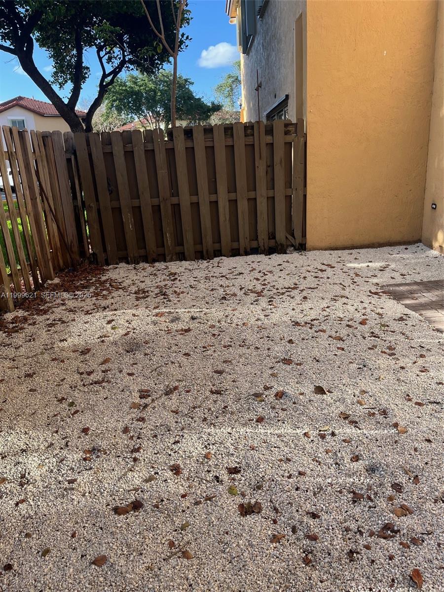 1650 Northeast 33rd Road, Unit 10610 Homestead, FL 33033 - Photo 19 of 22 a view of wooden fence