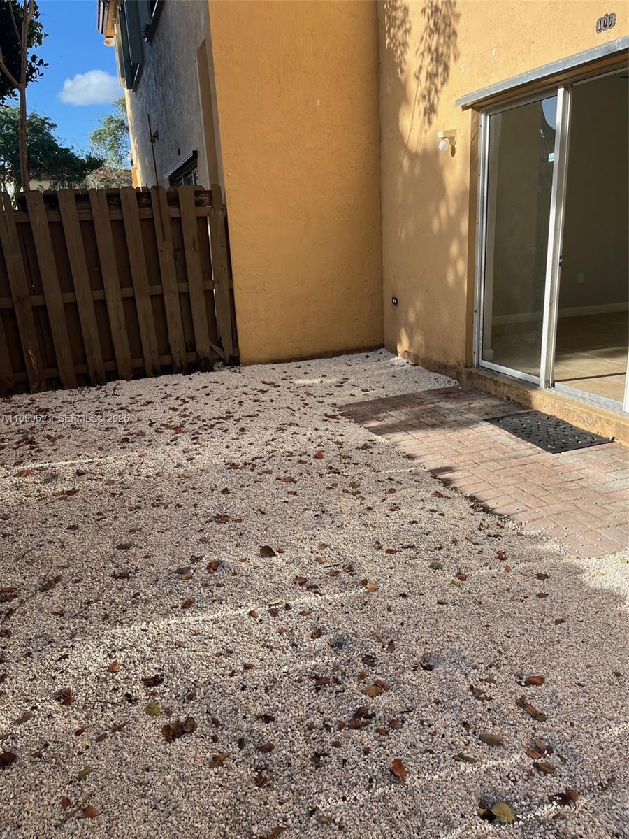 1650 Northeast 33rd Road, Unit 10610 Homestead, FL 33033 - Photo 20 of 22 a view of wooden fence