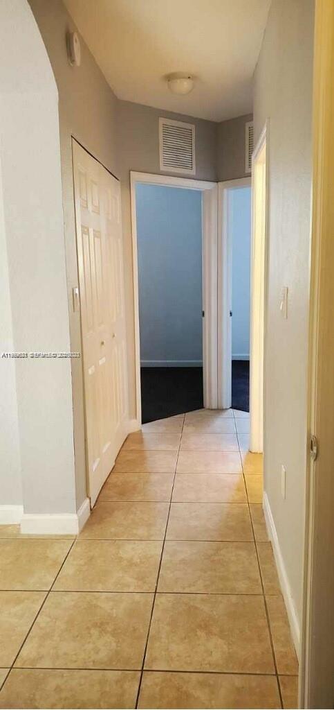 1650 Northeast 33rd Road, Unit 10610 Homestead, FL 33033 - Photo 9 of 22 a view of hallway with an empty room
