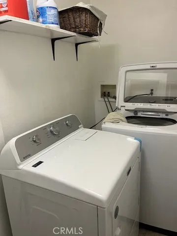 a kitchen with granite countertop a stove top oven cabinetry a sink and a counter top space