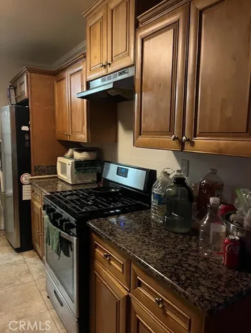 a bathroom with a sink and mirror with toilet