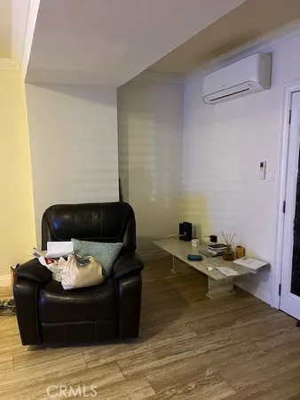 a large bed sitting in a bedroom next to a large window