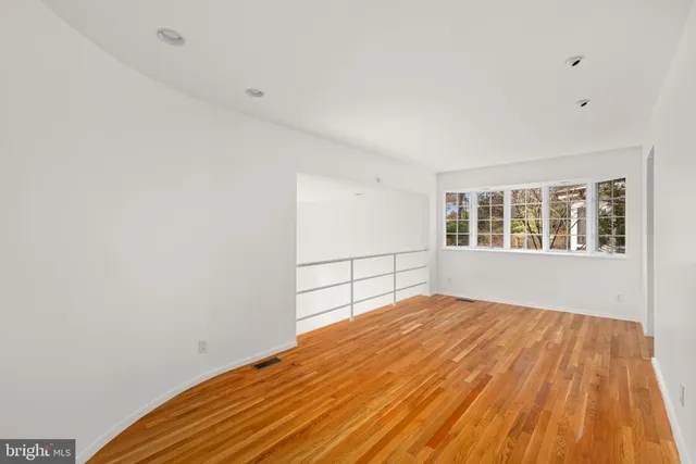 a view of empty room with windows