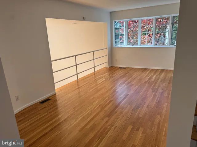 a view of front door with wooden floor
