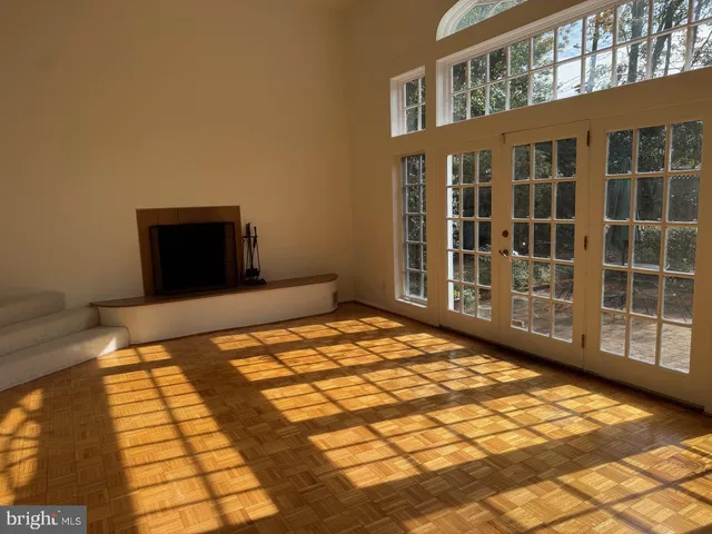 a view of an empty room with windows
