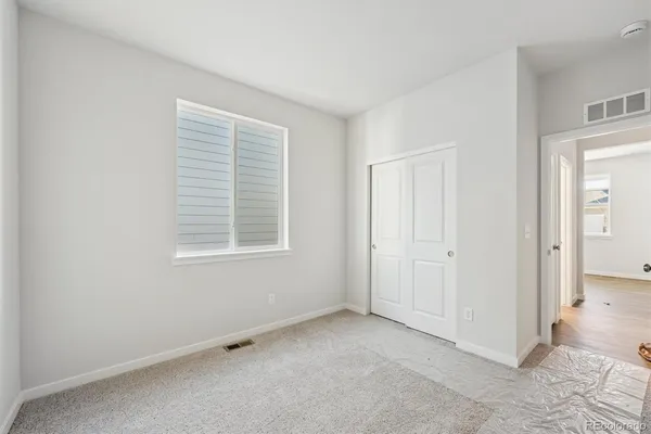 a view of an empty room with a window