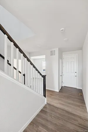a view of an entryway with wooden floor