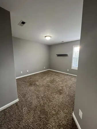 en empty room with windows
