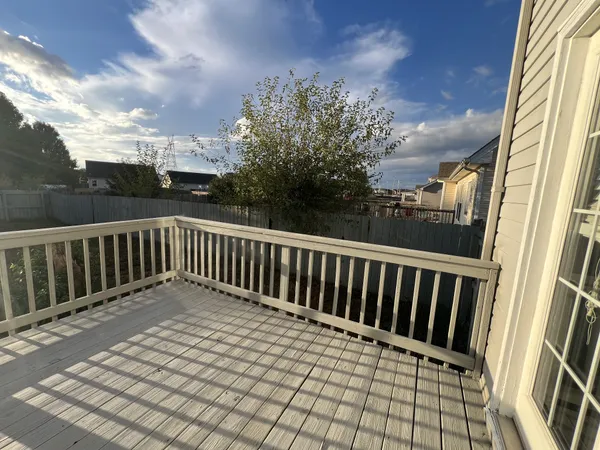 a view of balcony with wooden floor