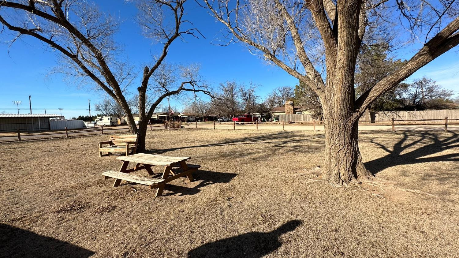 1014 Ave M Ralls, TX 79357 - Photo 2 of 13 a view of a backyard with large trees