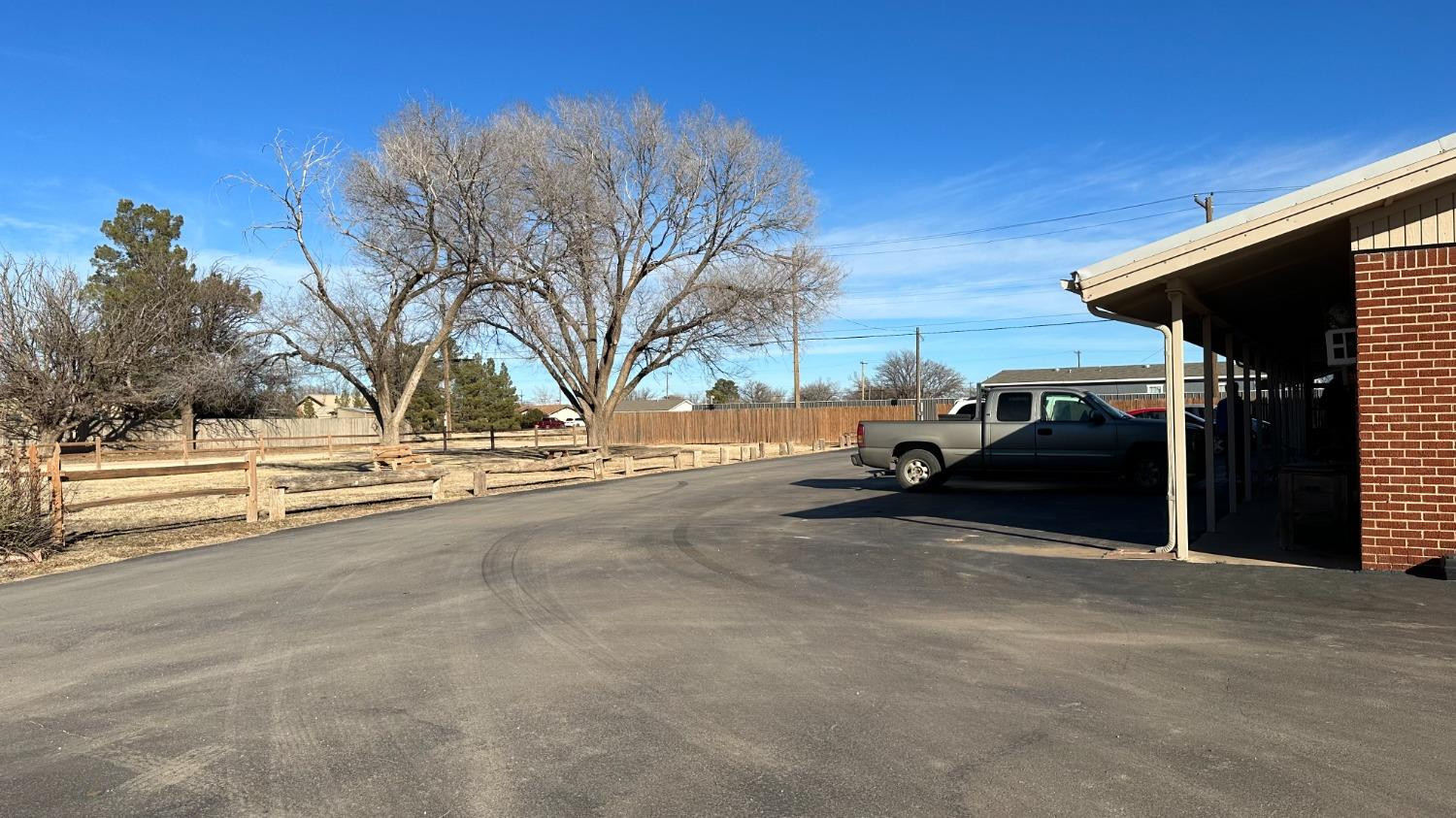 1014 Ave M Ralls, TX 79357 - Photo 4 of 13 a view of street with parked cars
