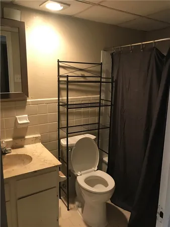 a bathroom with a toilet and a sink