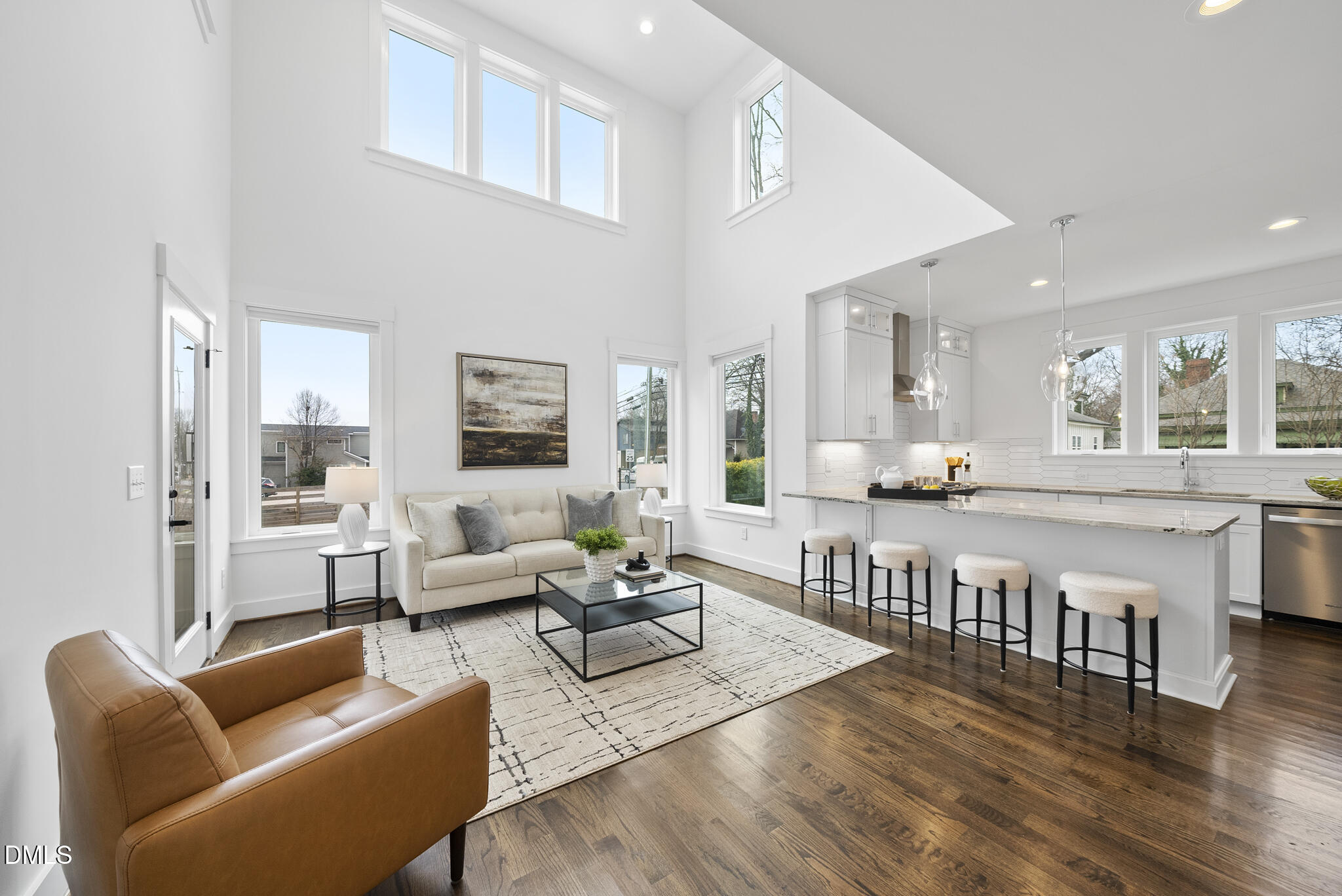 200 Bledsoe Avenue Raleigh, NC 27601 - Photo 1 of 42 a living room with furniture wooden floor and a large window