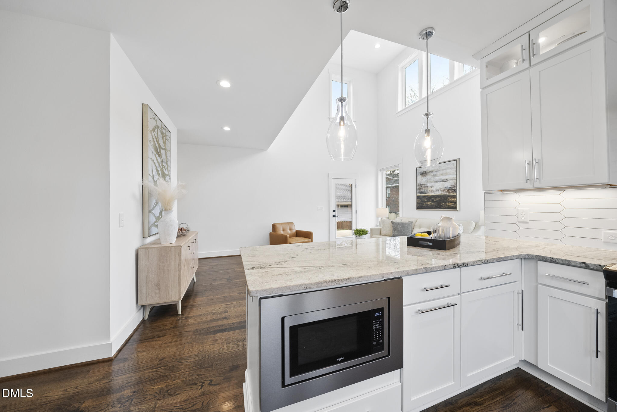 200 Bledsoe Avenue Raleigh, NC 27601 - Photo 11 of 42 a kitchen with a sink dishwasher a stove and a refrigerator with wooden floor