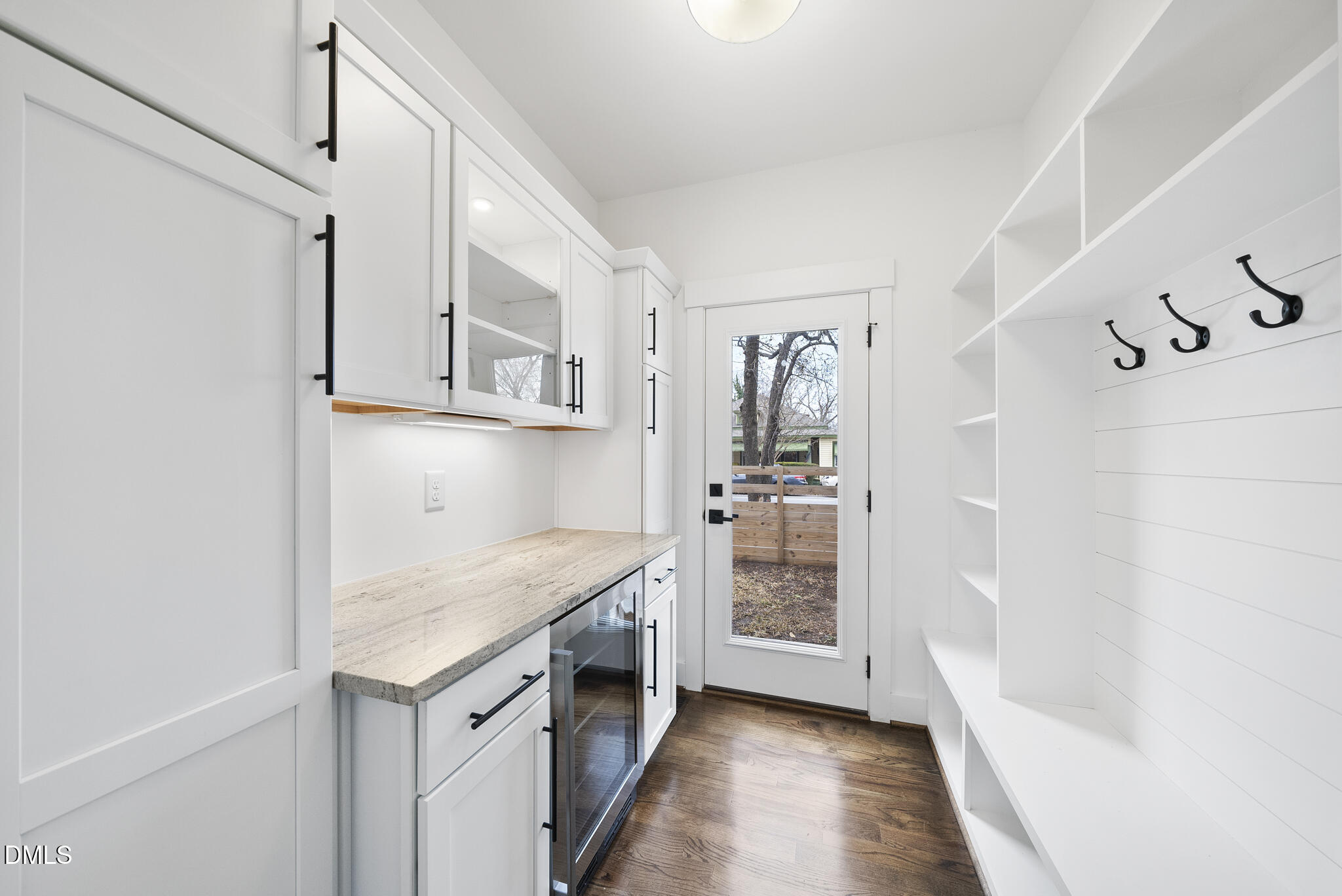 200 Bledsoe Avenue Raleigh, NC 27601 - Photo 12 of 42 a kitchen with cabinets and wooden floor