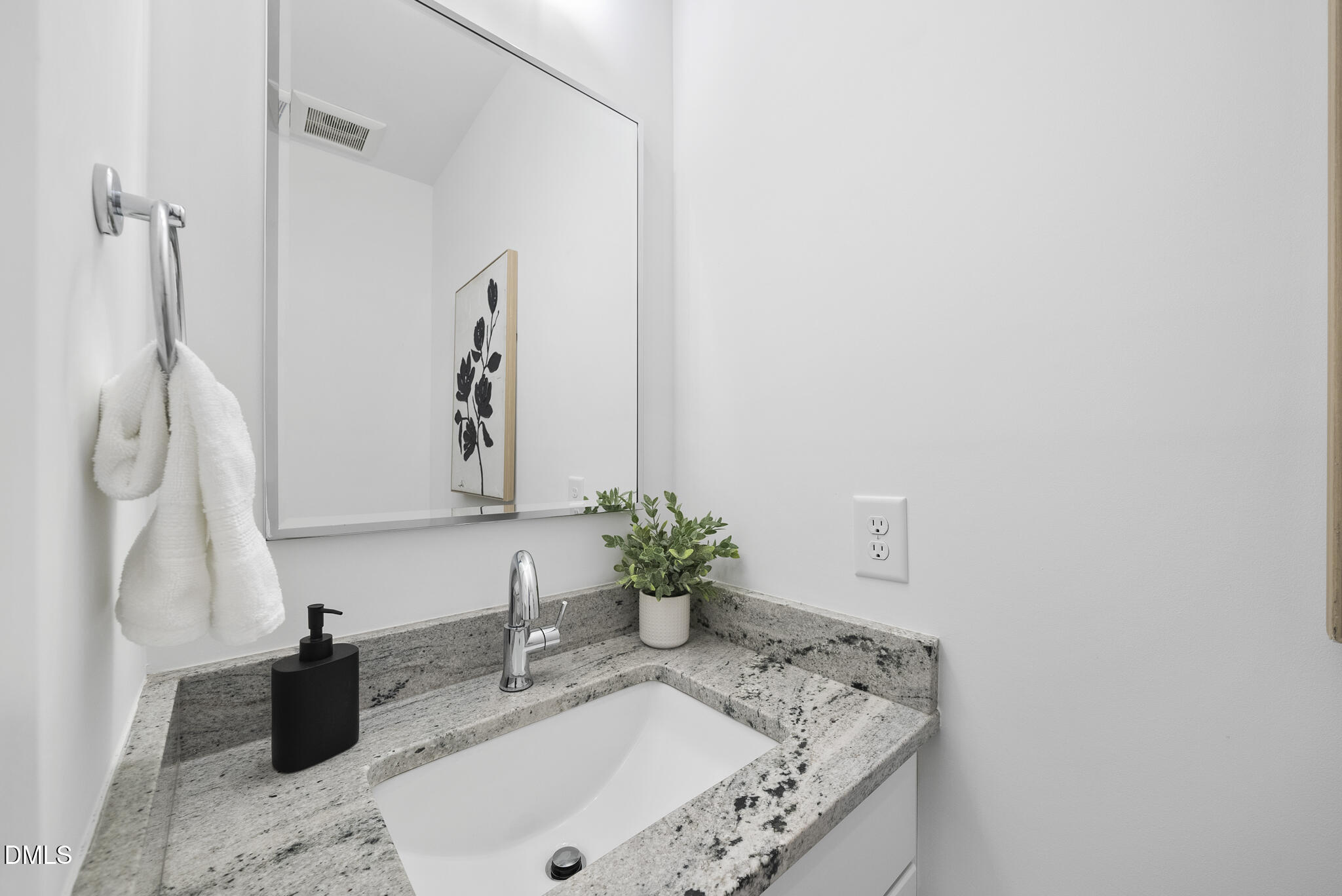 200 Bledsoe Avenue Raleigh, NC 27601 - Photo 13 of 42 a bathroom with a sink vanity and a mirror