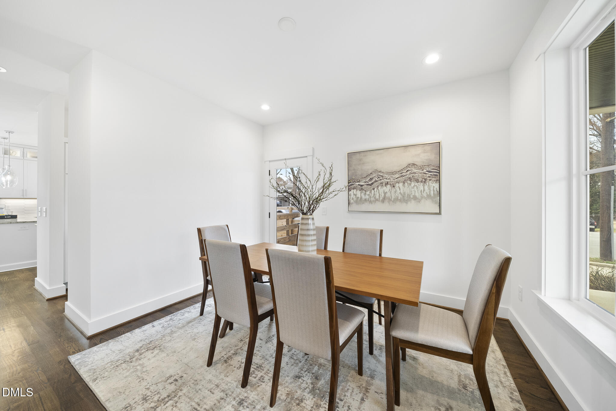 200 Bledsoe Avenue Raleigh, NC 27601 - Photo 15 of 42 a view of a dining room with furniture and wooden floor