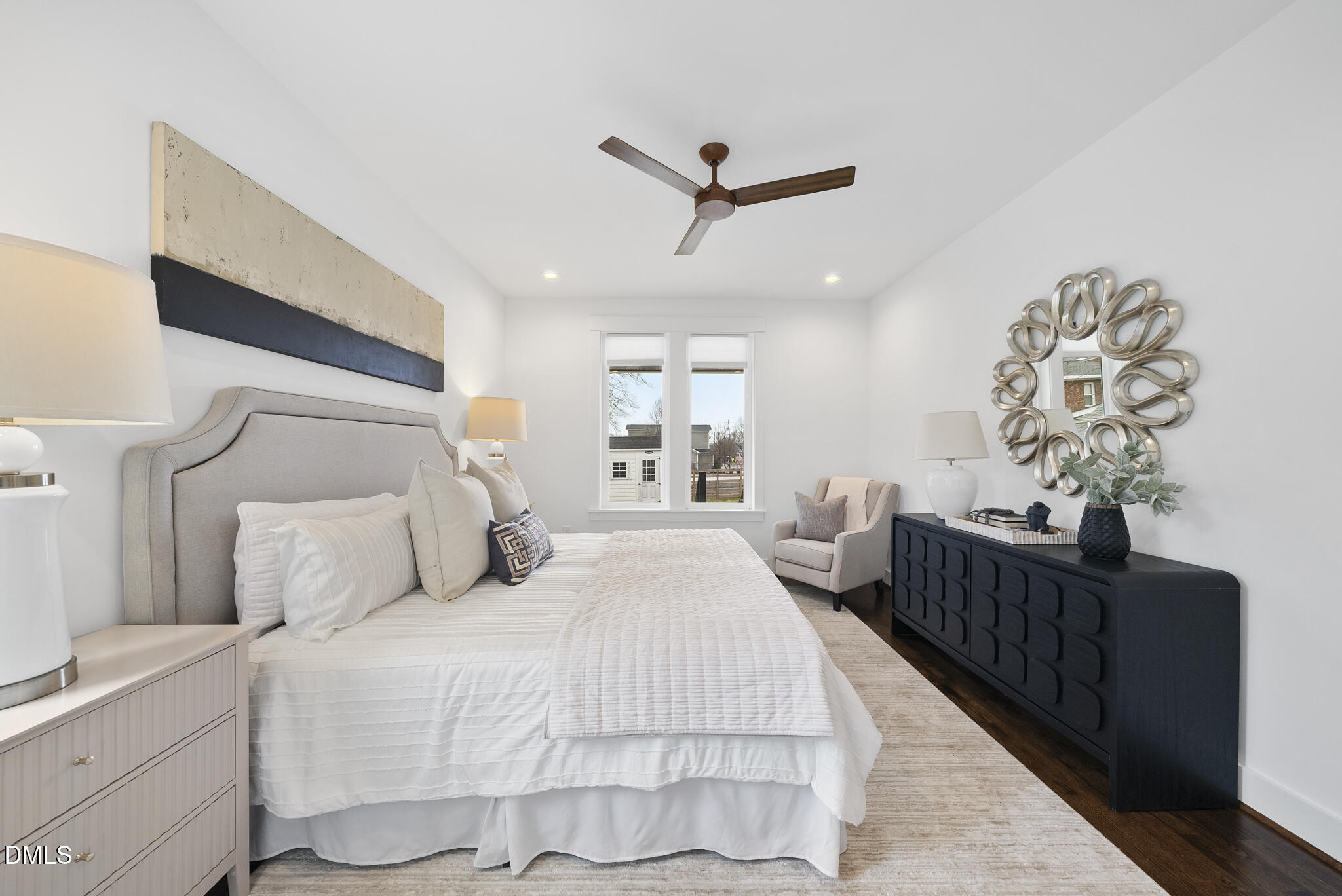 200 Bledsoe Avenue Raleigh, NC 27601 - Photo 17 of 42 a bedroom with a large bed and a chandelier