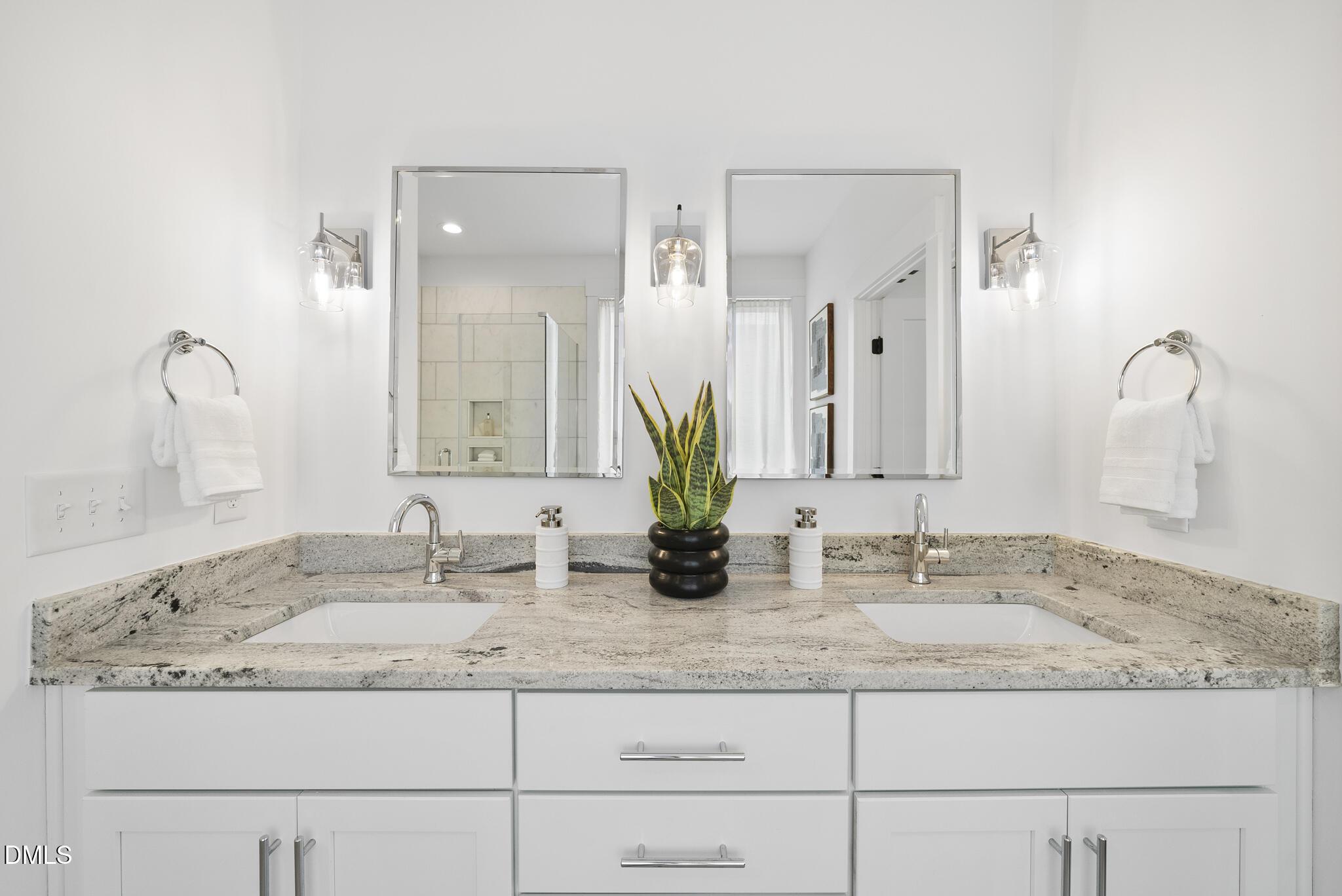 200 Bledsoe Avenue Raleigh, NC 27601 - Photo 20 of 42 a bathroom with double sink and a mirror