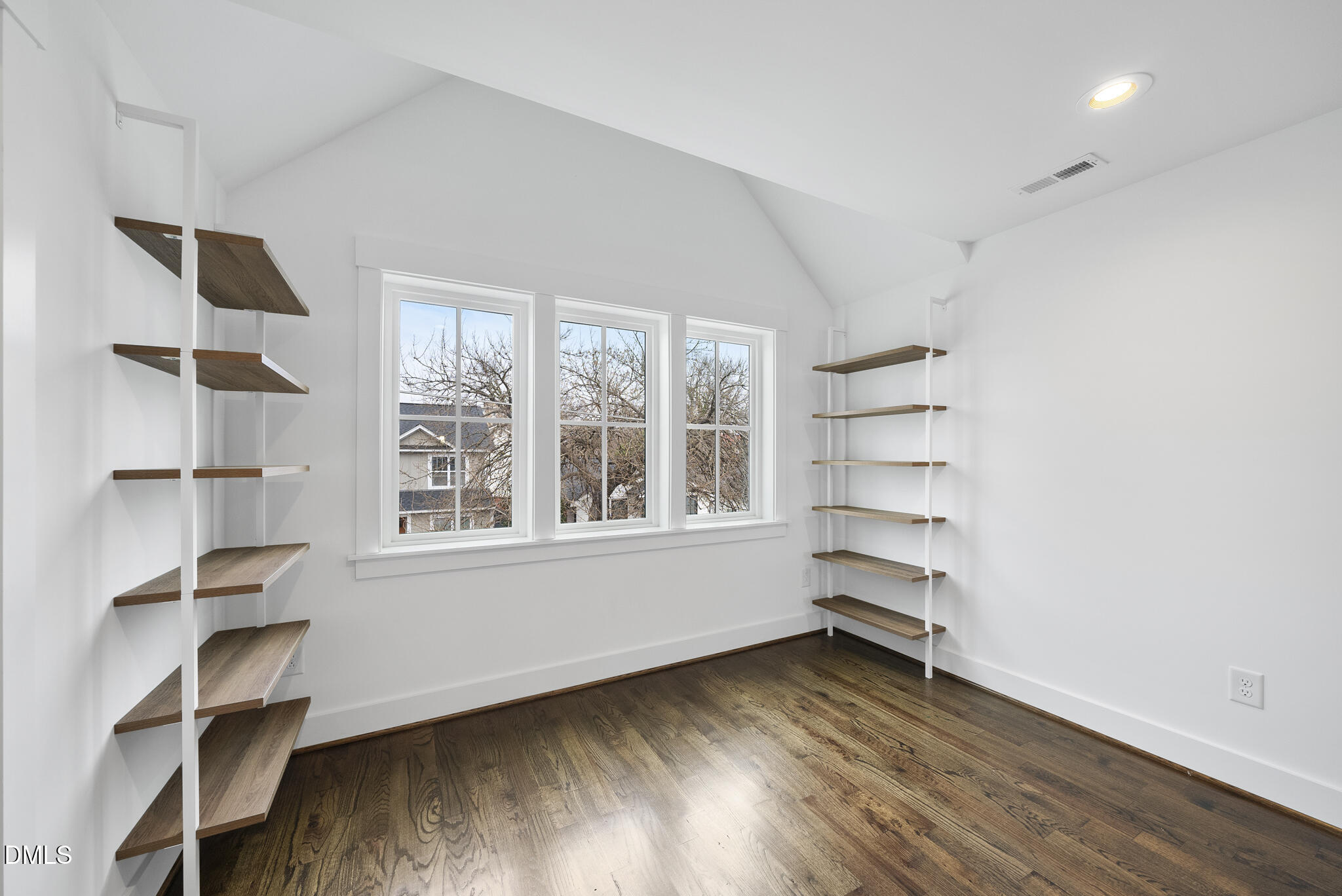 200 Bledsoe Avenue Raleigh, NC 27601 - Photo 23 of 42 an empty room with wooden floor and windows