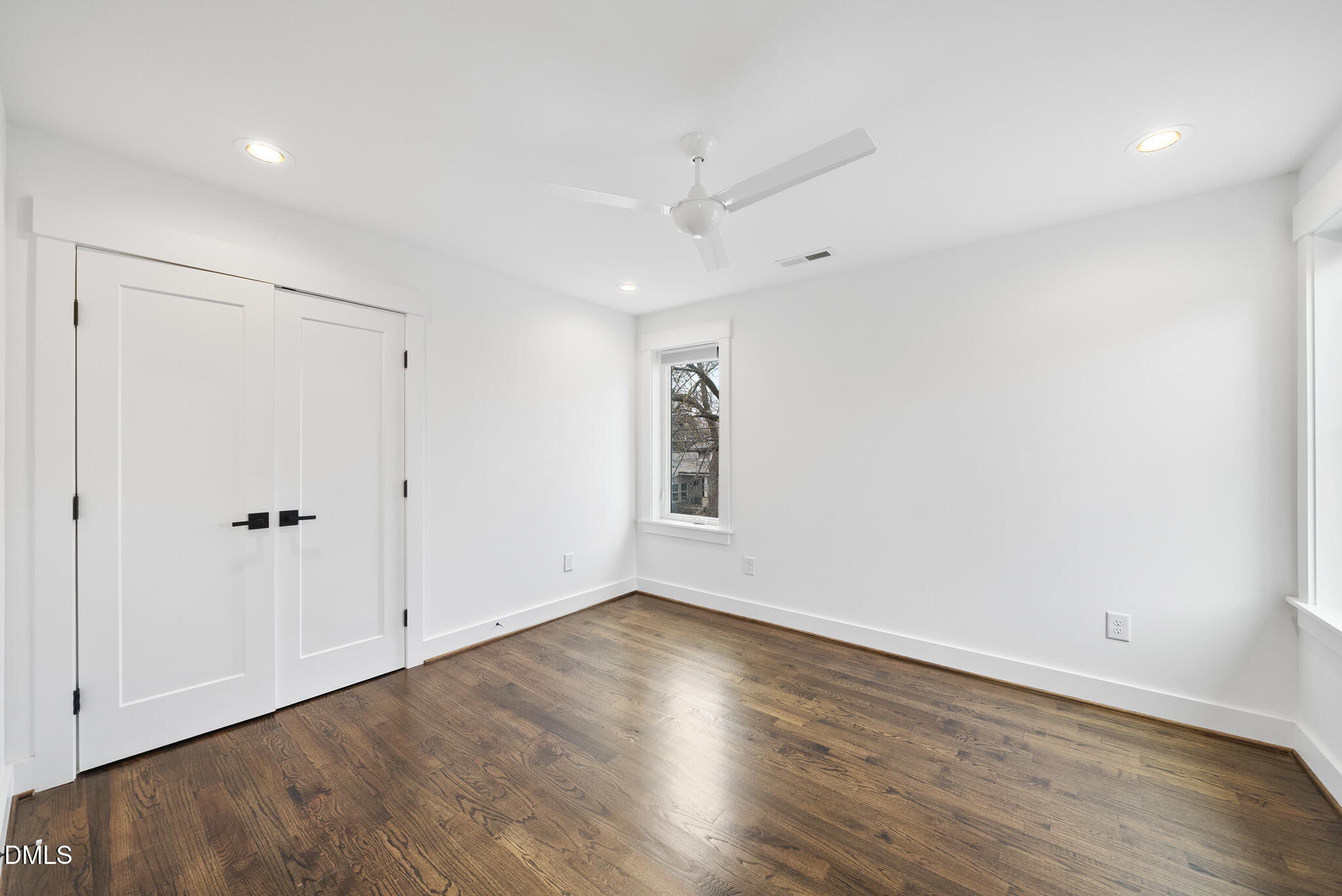 200 Bledsoe Avenue Raleigh, NC 27601 - Photo 27 of 42 a view of an empty room with wooden floor