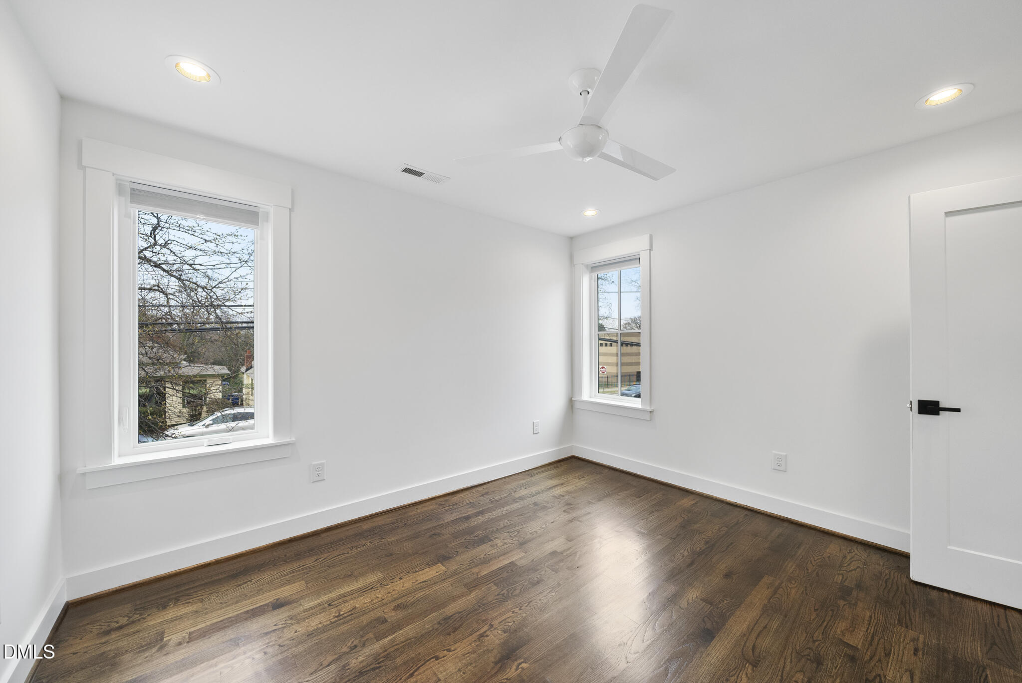 200 Bledsoe Avenue Raleigh, NC 27601 - Photo 28 of 42 an empty room with wooden floor and windows