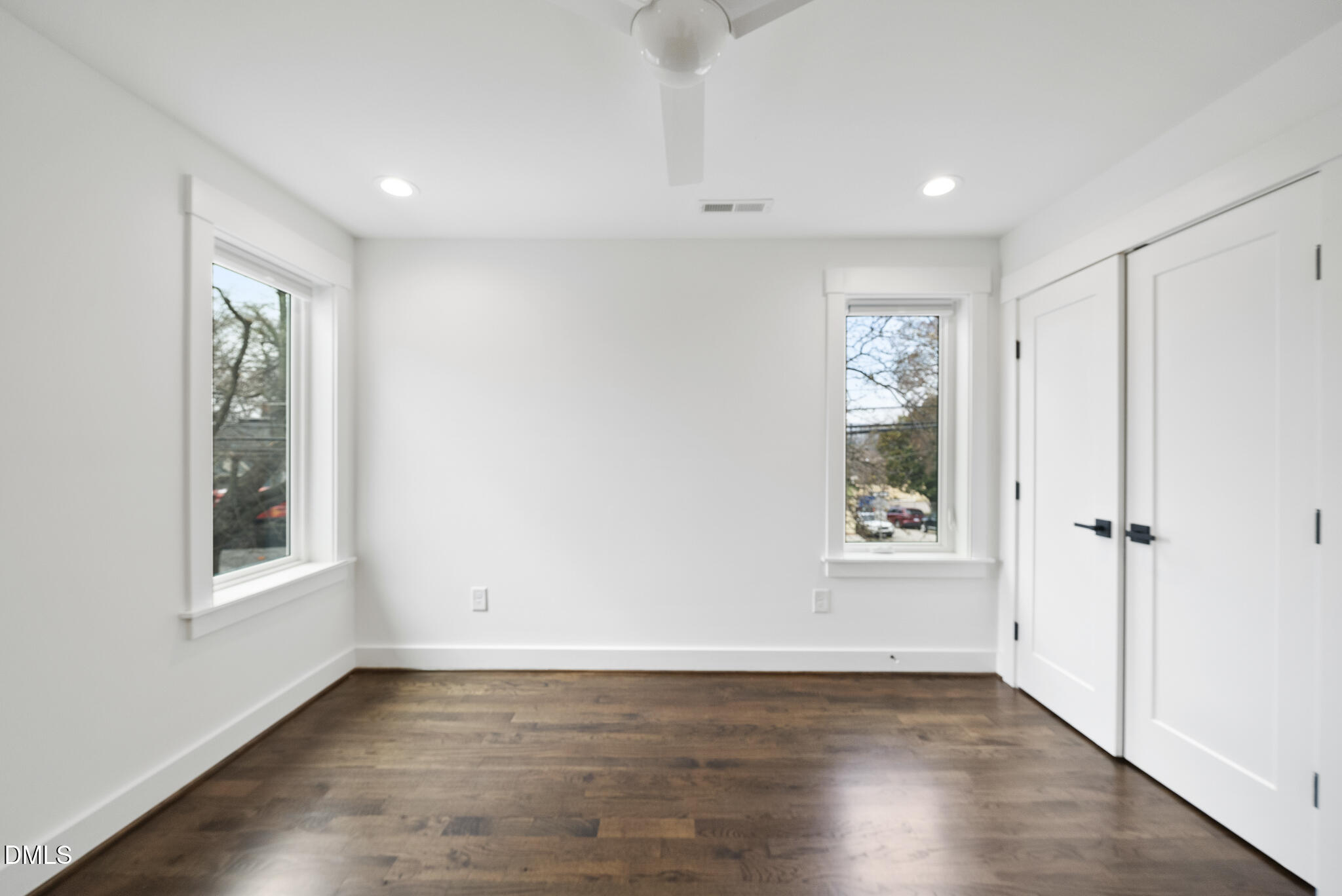 200 Bledsoe Avenue Raleigh, NC 27601 - Photo 30 of 42 an empty room with wooden floor and windows